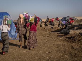 Refugees walking down a dirt road