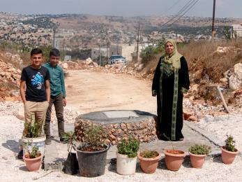 A family with their new pear-shaped well.