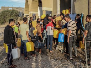 People queue to fetch water in the southern Gaza Strip city of Khan Younis, on Nov. 11, 2023. Photo by Rizek Abdeljawad/Xinhua via Getty Images